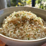 Close-up of fluffy white rice on a plate.