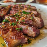 Close-up of juicy Carne de Panela com Sabor de Churrasco served on a plate.