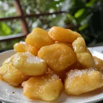 Close-up of a juicy Massa de Esfiha Fechada, showcasing its golden-brown crust.