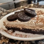 Close-up view of creamy No Bake Oreo Dessert Cups topped with crushed Oreos.