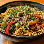 ['Prato de yakisoba com tiras de carne, legumes e macarrão.', 'Close-up de um yakisoba colorido e saboroso.', 'Yakisoba fácil preparado com carne e vegetais frescos.', 'Porção de yakisoba com ingredientes frescos e suculentos.']