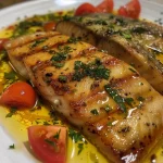 Prato de Peixe à escabeche com filés de pescada e legumes.